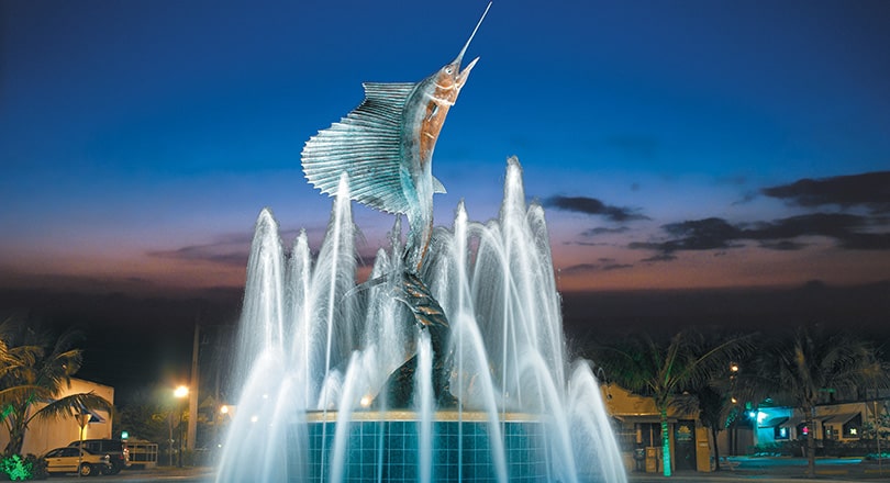 Sailfish Fountain lit up at night in downtown Stuart, Florida